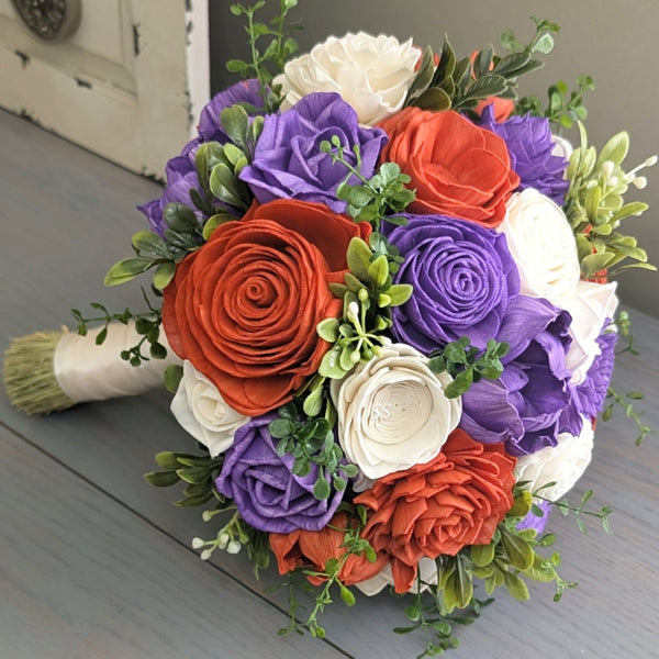 purple bridesmaid dresses with orange flowers bright colored bouquets really pop on a purple dress, love when brides stray from traditional purple and white!